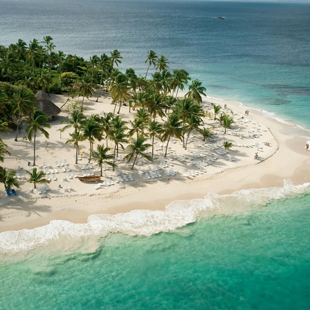 Aerial view of Cayo Levantado with palm trees, white sun loungers on the sand and turquoise waters